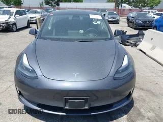 2023 Tesla Model 3 with VIN 5YJ3E1EA4PF400306, listed as a IAAI auction lot 42398603 with 18,551 mi miles and . Bid and sale history available at DreamBid. Image 13.