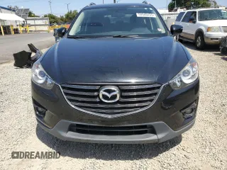 2016 Mazda CX-5 Touring with VIN JM3KE4CY2G0867484, listed as a Copart auction lot 54545435 with 100,664 mi miles and Salvage Title. Bid and sale history available at carsss.com. Image 5.