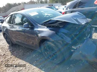 2023 Tesla Model Y Long Range with VIN 7SAYGDEE1PA053215, listed as a IAAI auction lot 41476973 with 58,025 mi miles and . Bid and sale history available at DreamBid. Image 12.