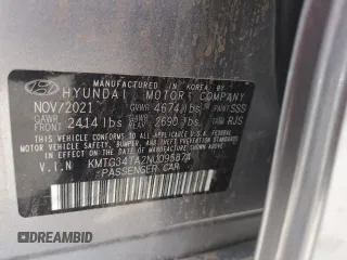 2022 Genesis G70 2.0T z VIN KMTG34TA2NU095874, wystawiony jako Copart lot #56803375 z przebiegiem 61 492 mil mil oraz Szkoda całkowita • Salvage title. Historia ofert i sprzedaży dostępna na DreamBid. Obrazek 13.