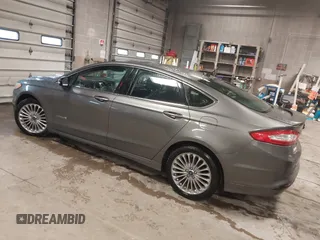 2013 Ford Fusion Titanium Hybrid with VIN 3FA6P0RU6DR319586, listed as a IAAI auction lot 42138979 with 125,388 mi miles. Bid and sale history available at carsss.com. Image 3.