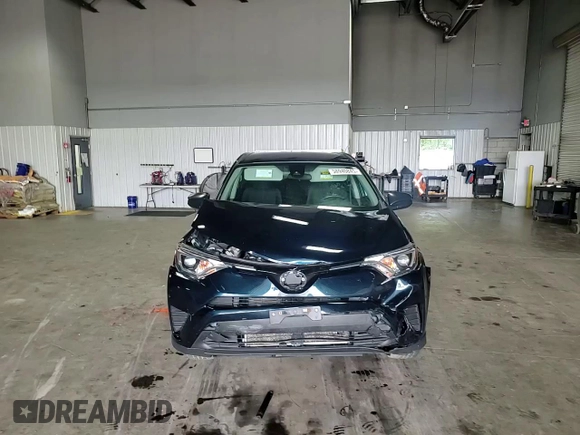 2017 Toyota RAV4 LE with VIN JTMBFREV6HJ165878, listed as a Copart auction lot 58940845 with 120,897 mi miles and Salvage title. Bid and sale history available at DreamBid. Image 14.