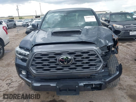 2022 Toyota Tacoma SR5 with VIN 3TMAZ5CN6NM186713, listed as a IAAI auction lot 42607719 with 60,704 mi miles and . Bid and sale history available at DreamBid. Image 12.