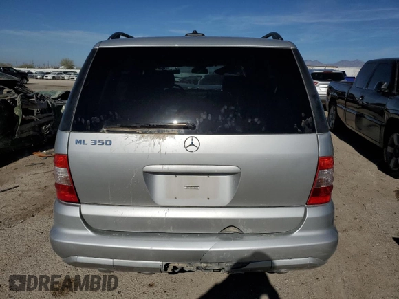 2003 Mercedes-Benz M 350 with VIN 4JGAB57E53A411711, listed as a Copart auction lot 85751154 with 114,483 mi miles and Salvage Title. Bid and sale history available at DreamBid. Image 6.