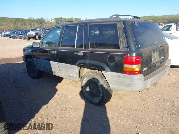 1998 Jeep Grand Cherokee Laredo with VIN 1J4FX58S7WC283734, listed as a IAAI auction lot 41267813 with 266,189 mi miles. Bid and sale history available at carsss.com. Image 3.