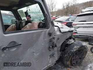 2014 Jeep Wrangler Unlimited Sport with VIN 1C4HJWDG1EL302087, listed as a IAAI auction lot 41420740 with 152,096 mi miles. Bid and sale history available at carsss.com. Image 22.