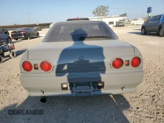 1992 Nissan Skyline z VIN HNR32035831, wystawiony jako Copart lot #74228974 z przebiegiem 49 082 mil mil oraz Szkoda całkowita • Salvage title. Historia ofert i sprzedaży dostępna na DreamBid. Obrazek 6.