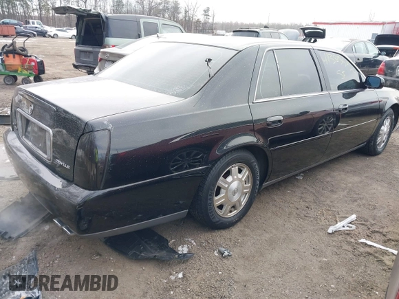 2003 Cadillac DeVille with VIN 1G6KD54Y33U126184, listed as a IAAI auction lot 41385354 with 83,982 mi miles. Bid and sale history available at carsss.com. Image 4.
