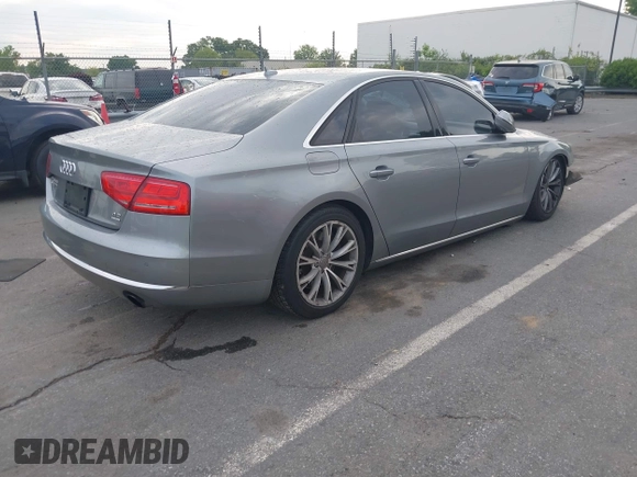 2011 Audi A8 with VIN WAUAVAFD0BN018197, listed as a IAAI auction lot 42221435 with 74,465 mi miles and . Bid and sale history available at DreamBid. Image 4.