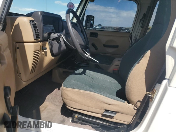 2000 Jeep Wrangler Sahara with VIN 1J4FA59S6YP790541, listed as a Copart auction lot 53837885 with 137,827 mi miles and Salvage title. Bid and sale history available at DreamBid. Image 7.