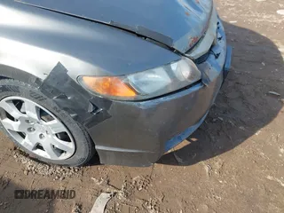 2006 Honda Civic LX z VIN 1HGFA16556L053589, wystawiony jako IAAI lot #41711938 z przebiegiem 230 523 mil mil oraz . Historia ofert i sprzedaży dostępna na DreamBid. Obrazek 12.