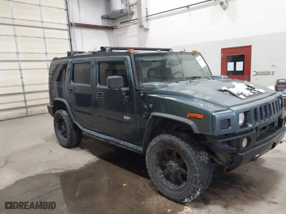 2005 Hummer H2 SUV with VIN 5GRGN23U65H132505, listed as a IAAI auction lot 41515346 with 140,944 mi miles. Bid and sale history available at carsss.com. Image 1.