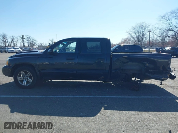 2007 Dodge Dakota SLT z VIN 1D7HW48JX7S196121, wystawiony jako IAAI lot #41863734 z przebiegiem 148 720 mil mil oraz . Historia ofert i sprzedaży dostępna na DreamBid. Obrazek 14.
