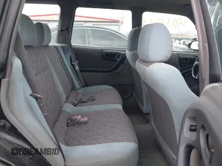 1999 Subaru Forester L with VIN JF1SF6351XH702931, listed as a IAAI auction lot 41612373 with 149,171 mi miles. Bid and sale history available at carsss.com. Image 8.