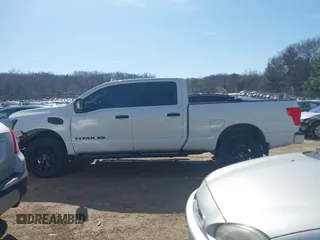 2018 Nissan Titan XD SV with VIN 1N6BA1F40JN523851, listed as a IAAI auction lot 41800730 with 104,527 mi miles. Bid and sale history available at carsss.com. Image 14.