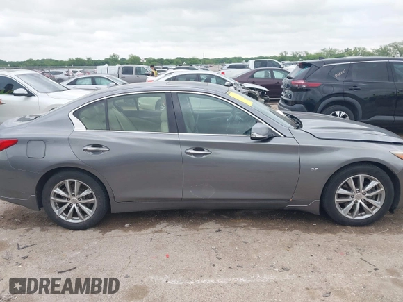 2015 Infiniti Q50 Premium z VIN JN1BV7AR9FM413801, wystawiony jako IAAI lot #42134770 z przebiegiem 111 367 mil mil oraz . Historia ofert i sprzedaży dostępna na DreamBid. Obrazek 13.