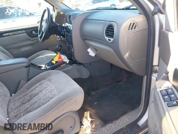 2004 GMC Envoy SLE with VIN 1GKDT13S642213710, listed as a IAAI auction lot 41680656 with 239,187 mi miles. Bid and sale history available at carsss.com. Image 5.