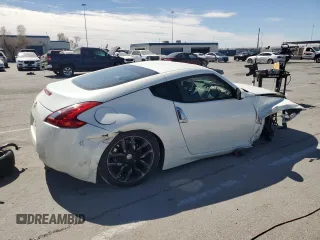 2014 Nissan 370Z Nismo with VIN JN1AZ4EH2EM633022, listed as a Copart auction lot 46947575 with 115,042 mi miles and Salvage Title. Bid and sale history available at DreamBid. Image 3.
