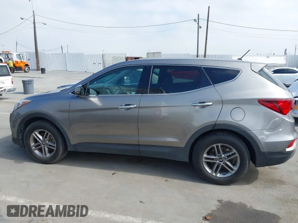 2018 Hyundai Santa Fe 2.4L with VIN 5NMZT3LB4JH069868, listed as a IAAI auction lot 42675555 with 142,612 mi miles and . Bid and sale history available at DreamBid. Image 14.