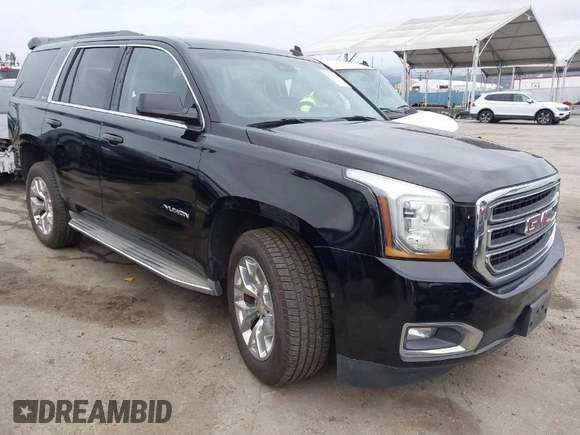 2015 GMC Yukon SLT with VIN 1GKS1BKC3FR129173, listed as a IAAI auction lot 41795585 with 97,893 mi miles. Bid and sale history available at carsss.com. Image 1.