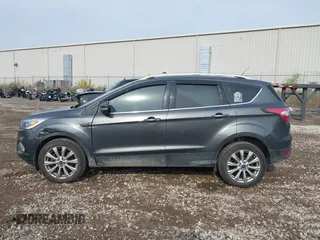 2017 Ford Escape Titanium with VIN 1FMCU9J98HUA49434, listed as a IAAI auction lot 40710866 with 143,850 mi miles. Bid and sale history available at carsss.com. Image 14.