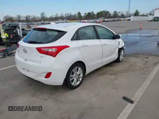 2013 Hyundai Elantra GT with VIN KMHD35LE1DU145894, listed as a IAAI auction lot 41828751 with 90,529 mi miles. Bid and sale history available at carsss.com. Image 4.