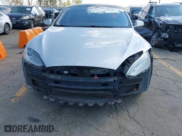 2014 Tesla Model S 60 z VIN 5YJSA1H16EFP28486, wystawiony jako IAAI lot #41887484 z przebiegiem 99 271 mil mil oraz . Historia ofert i sprzedaży dostępna na DreamBid. Obrazek 6.