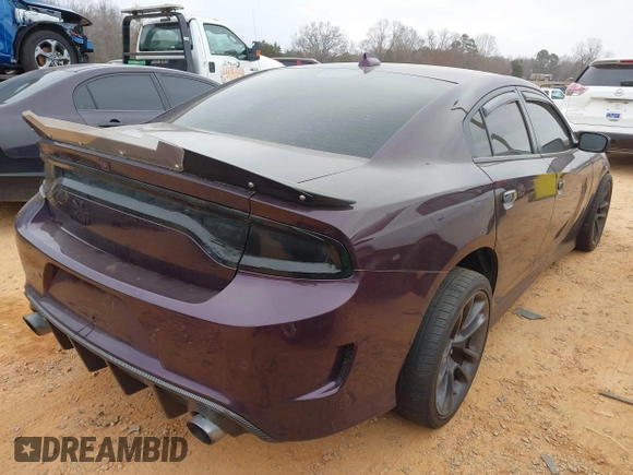 2021 Dodge Charger Scat Pack Widebody with VIN 2C3CDXGJ5MH579324, listed as a IAAI auction lot 41399676 with 77,156 mi miles and . Bid and sale history available at DreamBid. Image 4.
