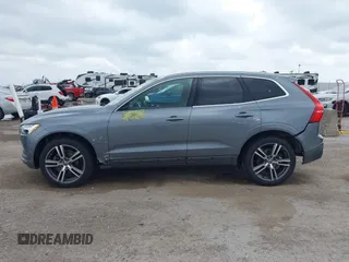 2018 Volvo XC60 Momentum z VIN LYV102RK1JB079168, wystawiony jako IAAI lot #42115403 z przebiegiem 58 377 mil mil oraz . Historia ofert i sprzedaży dostępna na DreamBid. Obrazek 14.