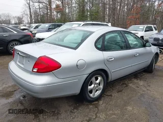 2003 Ford Taurus SE Standard with VIN 1FAFP53273G132268, listed as a IAAI auction lot 41790335 with 202,724 mi miles. Bid and sale history available at carsss.com. Image 4.
