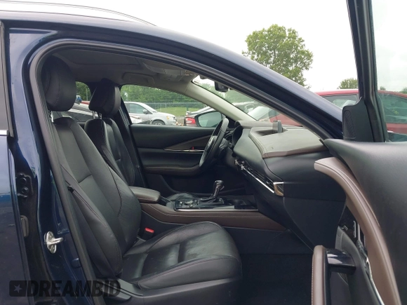 2022 Mazda CX-30 S Premium with VIN 3MVDMBDL0NM413545, listed as a IAAI auction lot 42493594 with 57,013 mi miles and . Bid and sale history available at DreamBid. Image 5.