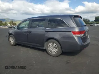 2015 Honda Odyssey LX with VIN 5FNRL5H27FB018491, listed as a Copart auction lot 54888445 with 129,488 mi miles and Salvage Title. Bid and sale history available at DreamBid. Image 2.