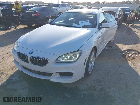 2015 BMW 6 Series 640i xDrive with VIN WBA6B8C50FD453317, listed as a IAAI auction lot 41635430 with 77,811 mi miles and . Bid and sale history available at DreamBid. Image 2.