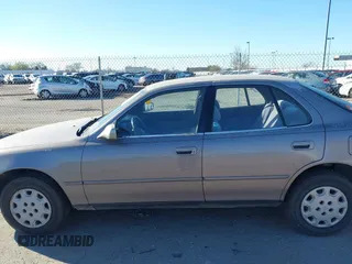 1995 Toyota Camry LE z VIN JT2SK12E0S0286848, wystawiony jako IAAI lot #41862969 z przebiegiem 220 923 mil mil oraz . Historia ofert i sprzedaży dostępna na DreamBid. Obrazek 6.