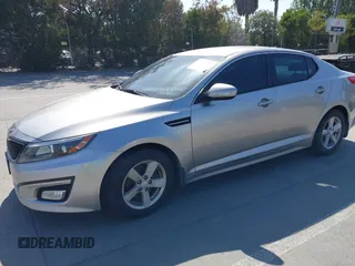 2014 Kia Optima LX with VIN KNAGM4A70E5482966, listed as a IAAI auction lot 42109539 with 194,519 mi miles and . Bid and sale history available at carsss.com. Image 2.