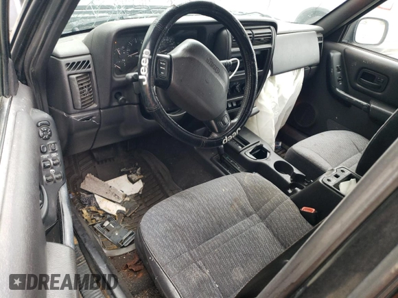 2001 Jeep Cherokee Sport с VIN 1J4FF48S31L615450, выставлен на аукционе Copart как лот 55835585 с пробегом 246 694 миль миль и Списание • Salvage title. История ставок и продаж доступна на DreamBid. Изображение 8.