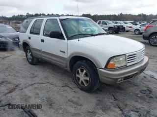 2001 Oldsmobile Bravada z VIN 1GHDT13W512122383, wystawiony jako IAAI lot #41624026 z przebiegiem 176 973 mil mil oraz . Historia ofert i sprzedaży dostępna na DreamBid. Obrazek 1.