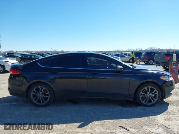 2018 Ford Fusion SE z VIN 3FA6P0H77JR180057, wystawiony jako IAAI lot #41729451 z przebiegiem 122 200 mil mil oraz . Historia ofert i sprzedaży dostępna na DreamBid. Obrazek 13.