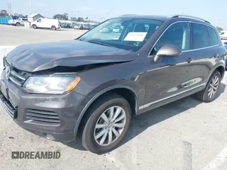 2011 Volkswagen Touareg Sport with VIN WVGFF9BP3BD002517, listed as a IAAI auction lot 42174143 with 156,337 mi miles and . Bid and sale history available at DreamBid. Image 2.