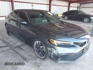2023 Honda Civic Sport Touring with VIN 19XFL1H83PE006877, listed as a IAAI auction lot 42497488 with 33,674 mi miles and . Bid and sale history available at DreamBid. Image 1.