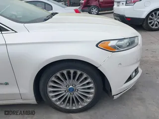 2014 Ford Fusion Titanium Hybrid with VIN 3FA6P0RU6ER115985, listed as a IAAI auction lot 41870494 with 132,321 mi miles. Bid and sale history available at carsss.com. Image 12.