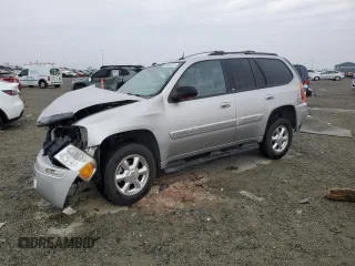 2004 GMC Envoy SLE with VIN 1GKDS13S142358446, listed as a Copart auction lot 43383935 with 154,358 mi miles and Salvage Title. Bid and sale history available at carsss.com. Image 1.