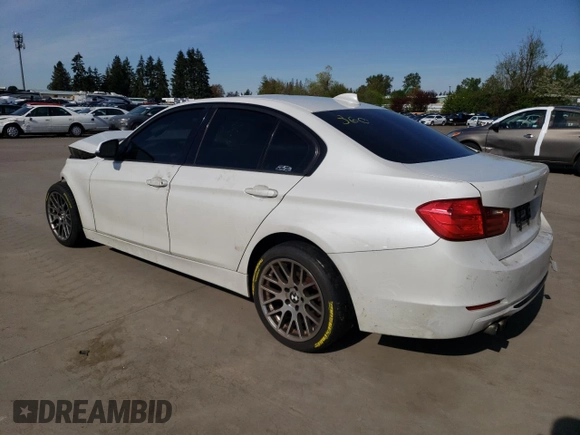 2012 BMW 3 Series 328i with VIN WBA3C1C5XCA696847, listed as a Copart auction lot 53005425 with 143,725 mi miles and Salvage title. Bid and sale history available at DreamBid. Image 2.