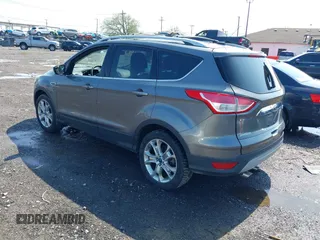 2014 Ford Escape Titanium with VIN 1FMCU9J99EUA75276, listed as a IAAI auction lot 42148537 with 163,330 mi miles and . Bid and sale history available at DreamBid. Image 3.