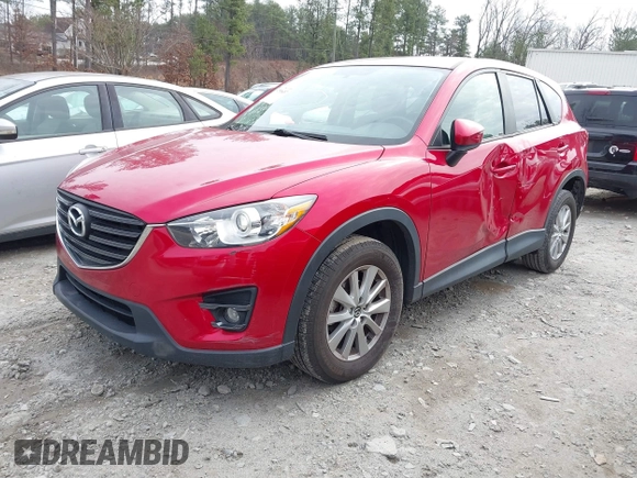 2016 Mazda CX-5 Touring z VIN JM3KE2CY3G0894441, wystawiony jako IAAI lot #41508767 z przebiegiem 88 554 mil mil oraz . Historia ofert i sprzedaży dostępna na DreamBid. Obrazek 2.
