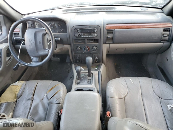 1999 Jeep Grand Cherokee Laredo with VIN 1J4GW58N9XC730311, listed as a Copart auction lot 77774544 with 0 mi miles and Salvage Title. Bid and sale history available at carsss.com. Image 8.
