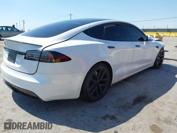 2023 Tesla Model S with VIN 5YJSA1E59PF500816, listed as a IAAI auction lot 42409049 with Not provided miles and . Bid and sale history available at DreamBid. Image 4.