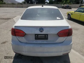 2014 Volkswagen Jetta SE with VIN 3VWD17AJ5EM295208, listed as a Copart auction lot 64684005 with 94,133 mi miles and Salvage title. Bid and sale history available at DreamBid. Image 6.