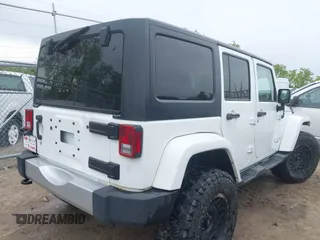 2015 Jeep Wrangler Unlimited Sahara с VIN 1C4BJWEG1FL506393, выставлен на аукционе IAAI как лот 42326900 с пробегом 100 538 миль миль и . История ставок и продаж доступна на DreamBid. Изображение 4.