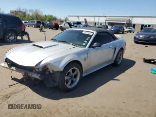 1999 Ford Mustang with VIN 1FAFP4448XF233101, listed as a Copart auction lot 54701005 with 54,585 mi miles and Salvage title. Bid and sale history available at DreamBid. Image 1.